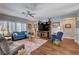 Bright living room with modern furniture, ceiling fan and a large area rug at 2078 Wildwood Lake St, Henderson, NV 89052