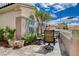 Cozy patio with outdoor seating, mature plants, and a serene atmosphere for relaxation at 2078 Wildwood Lake St, Henderson, NV 89052
