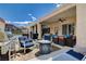 Covered patio featuring a grill, seating area, lounge chairs, and pool view at 2078 Wildwood Lake St, Henderson, NV 89052