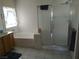 Bathroom features a tub, shower with glass doors and a vanity with sink at 2148 Hidden Ranch Ter, Henderson, NV 89052