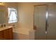Bathroom featuring a soaking tub, shower, and vanity with ample countertop space at 2148 Hidden Ranch Ter, Henderson, NV 89052