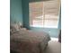 Relaxing bedroom with a comfortable bed, soft natural light, and soothing color palette at 2148 Hidden Ranch Ter, Henderson, NV 89052