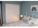 Calming bedroom with a white closet door and a plush bed featuring a decorative pillow at 2148 Hidden Ranch Ter, Henderson, NV 89052