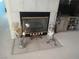 Cozy fireplace with tiled surround, complemented by stylish decor and a comfortable ambiance at 2148 Hidden Ranch Ter, Henderson, NV 89052