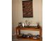 Stylish hallway features a decorative wall hanging, lamps, and a wooden console table at 2148 Hidden Ranch Ter, Henderson, NV 89052