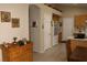 Open-concept kitchen with wooden cabinets, white appliances, and eat-in breakfast bar at 2148 Hidden Ranch Ter, Henderson, NV 89052