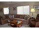 Comfortable living room features a large sectional sofa, creating a welcoming atmosphere at 2148 Hidden Ranch Ter, Henderson, NV 89052