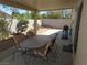 Covered patio with outdoor dining set perfect for entertaining or relaxation at 2148 Hidden Ranch Ter, Henderson, NV 89052