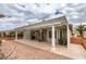 Backyard patio with pergola, ceiling fans, desert landscaping and view of neighboring homes at 2164 Eagle Sticks Dr, Henderson, NV 89012