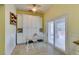 Bright eat-in kitchen features sliding glass doors to the backyard patio and custom white cabinetry at 2164 Eagle Sticks Dr, Henderson, NV 89012
