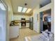 Modern kitchen with stainless steel appliances, granite countertops, white cabinetry, and light-filled skylights at 2164 Eagle Sticks Dr, Henderson, NV 89012