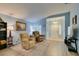 Inviting living room with tile entry, wood floors, comfortable recliners, and plenty of natural light at 2164 Eagle Sticks Dr, Henderson, NV 89012