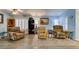 Open living room featuring comfortable furniture, a ceiling fan, and plantation shutters on the windows at 2164 Eagle Sticks Dr, Henderson, NV 89012