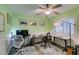 Bright home office with green walls, wainscotting, ceiling fan, and two work stations at 2164 Eagle Sticks Dr, Henderson, NV 89012