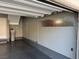 Clean garage interior featuring gray epoxy flooring and ample wall storage options at 2295 Koho Dr # 102, Las Vegas, NV 89183