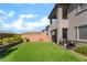The house's backyard includes a grill, patio furniture, and an immaculate lawn at 23 Strada Barbera, Henderson, NV 89011