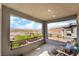 Relaxing balcony with comfortable seating offers beautiful views of the neighborhood at 23 Strada Barbera, Henderson, NV 89011