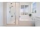 Bathroom featuring stand up shower, bath tub and natural light at 23 Strada Barbera, Henderson, NV 89011