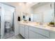 A modern bathroom featuring a double sink and plenty of cabinet space at 23 Strada Barbera, Henderson, NV 89011