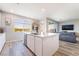 Bright and airy kitchen with large island, white cabinets, stainless steel appliances, and modern finishes at 23 Strada Barbera, Henderson, NV 89011