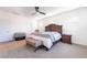 Bright bedroom with neutral carpet features furnishings, windows, and ceiling fan at 23 Strada Barbera, Henderson, NV 89011