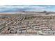 Expansive aerial view of a residential area with desert mountains in the distance, perfect for enjoying the outdoors at 236 Callen Falls Ave # 1211, Henderson, NV 89011