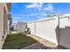 Private backyard with manicured lawn, paved patio, and charming outdoor seating area at 236 Callen Falls Ave # 1211, Henderson, NV 89011