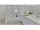 Stylish bathroom offers double sinks with quartz counters, and a large glass shower at 236 Callen Falls Ave # 1211, Henderson, NV 89011