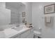 Clean bathroom featuring a white vanity, sink, mirror, and toilet at 236 Callen Falls Ave # 1211, Henderson, NV 89011