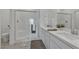 Modern bathroom features double sinks, white cabinets, and a glass-enclosed shower for a sleek design at 236 Callen Falls Ave # 1211, Henderson, NV 89011