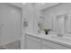 Bathroom featuring dual sinks with white countertops, offering a clean and modern design at 236 Callen Falls Ave # 1211, Henderson, NV 89011