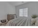 Well-lit bedroom featuring a bed, window, and white decor at 236 Callen Falls Ave # 1211, Henderson, NV 89011