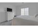 Bright bedroom featuring a white dresser, TV, window, and a comfortable-looking bed with soft pillows at 236 Callen Falls Ave # 1211, Henderson, NV 89011