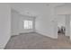 Bright bedroom offers carpet flooring and a view into an adjacent room, maximizing light and space at 236 Callen Falls Ave # 1211, Henderson, NV 89011