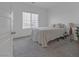 Bright, carpeted bedroom featuring modern decor and a large window at 236 Callen Falls Ave # 1211, Henderson, NV 89011