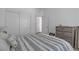 A well-lit bedroom featuring a cozy bed, modern decor, and closet space at 236 Callen Falls Ave # 1211, Henderson, NV 89011