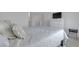 Cozy bedroom showcases a comfortable bed with throw pillows, complemented by a white dresser with a TV at 236 Callen Falls Ave # 1211, Henderson, NV 89011