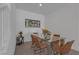 Dining room features a glass-top table with seating for six and modern decor at 236 Callen Falls Ave # 1211, Henderson, NV 89011