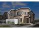 Two-story townhome with a landscaped front yard, fenced-in area, and manicured garden at 236 Callen Falls Ave # 1211, Henderson, NV 89011