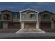 Two-story townhome featuring a private garage, well-maintained landscaping, and neutral color palette at 236 Callen Falls Ave # 1211, Henderson, NV 89011