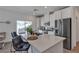 Bright kitchen featuring stainless steel appliances, ample counter space, and an adjacent living room at 236 Callen Falls Ave # 1211, Henderson, NV 89011