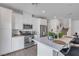 Modern kitchen with stainless steel appliances, white cabinets, and a spacious breakfast bar at 236 Callen Falls Ave # 1211, Henderson, NV 89011