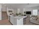 Stylish kitchen with a large center island, stainless appliances, and an adjacent living area at 236 Callen Falls Ave # 1211, Henderson, NV 89011