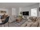 Spacious living room adjacent to the kitchen with contemporary furnishings and plenty of seating at 236 Callen Falls Ave # 1211, Henderson, NV 89011