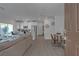Inviting open-concept living space featuring modern furniture, a kitchen island, and sliding glass doors at 236 Callen Falls Ave # 1211, Henderson, NV 89011
