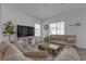 Cozy living room features a comfortable couch, bright windows, and stylish decor at 236 Callen Falls Ave # 1211, Henderson, NV 89011