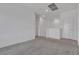 Neutral loft area with carpet flooring, showcasing the potential for a play area or study at 236 Callen Falls Ave # 1211, Henderson, NV 89011