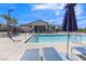 Inviting community pool area with lounge chairs, umbrellas, and clear blue water at 236 Callen Falls Ave # 1211, Henderson, NV 89011