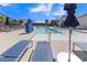Relaxing community pool area with lounge chairs under a clear blue sky at 236 Callen Falls Ave # 1211, Henderson, NV 89011