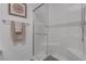 Modern tiled shower with glass door and silver fixtures at 236 Callen Falls Ave # 1211, Henderson, NV 89011